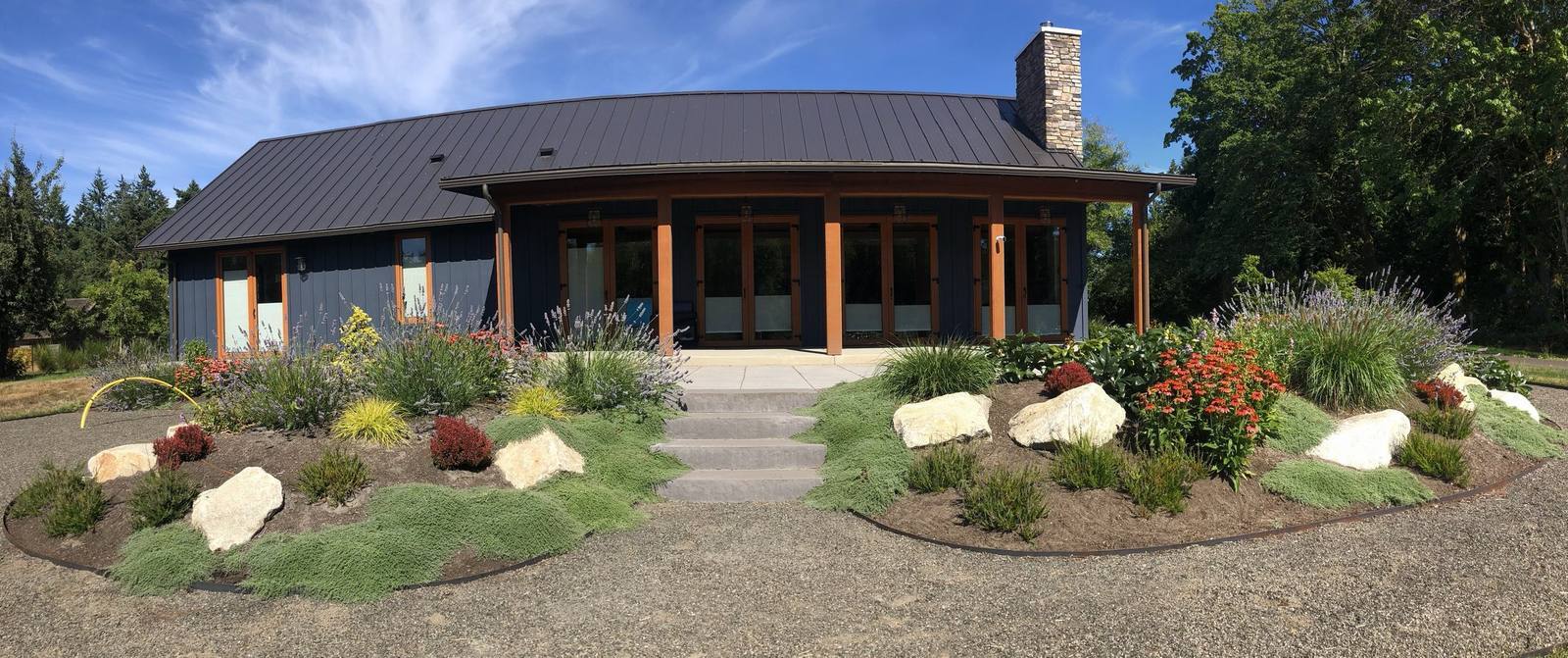 Completed estate garden with layered planting around a contemporary home