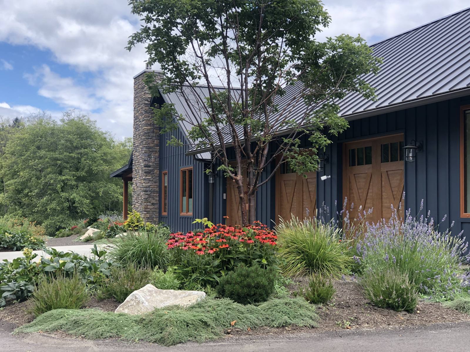 Colorful planting along the garage of a modern country home